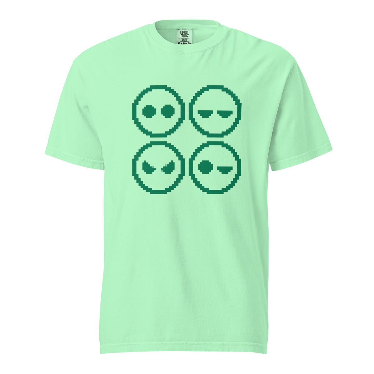 Front view of an Island Reef T-shirt featuring a four-panel pixel-art graphic of four simplified alien faces with varied expressions.