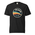 Front view of a black T-shirt with a circular retro Pluto design, colourful sweeping bands, stars, and “NEVER FORGET 1930–2006” text.
