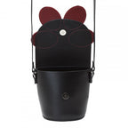 Black bucket bag with red accents on a white background