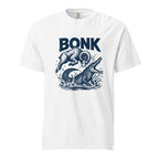 Front view of a white T-shirt featuring a leaping ram colliding with a crocodile amid splashing water, with “BONK” above.