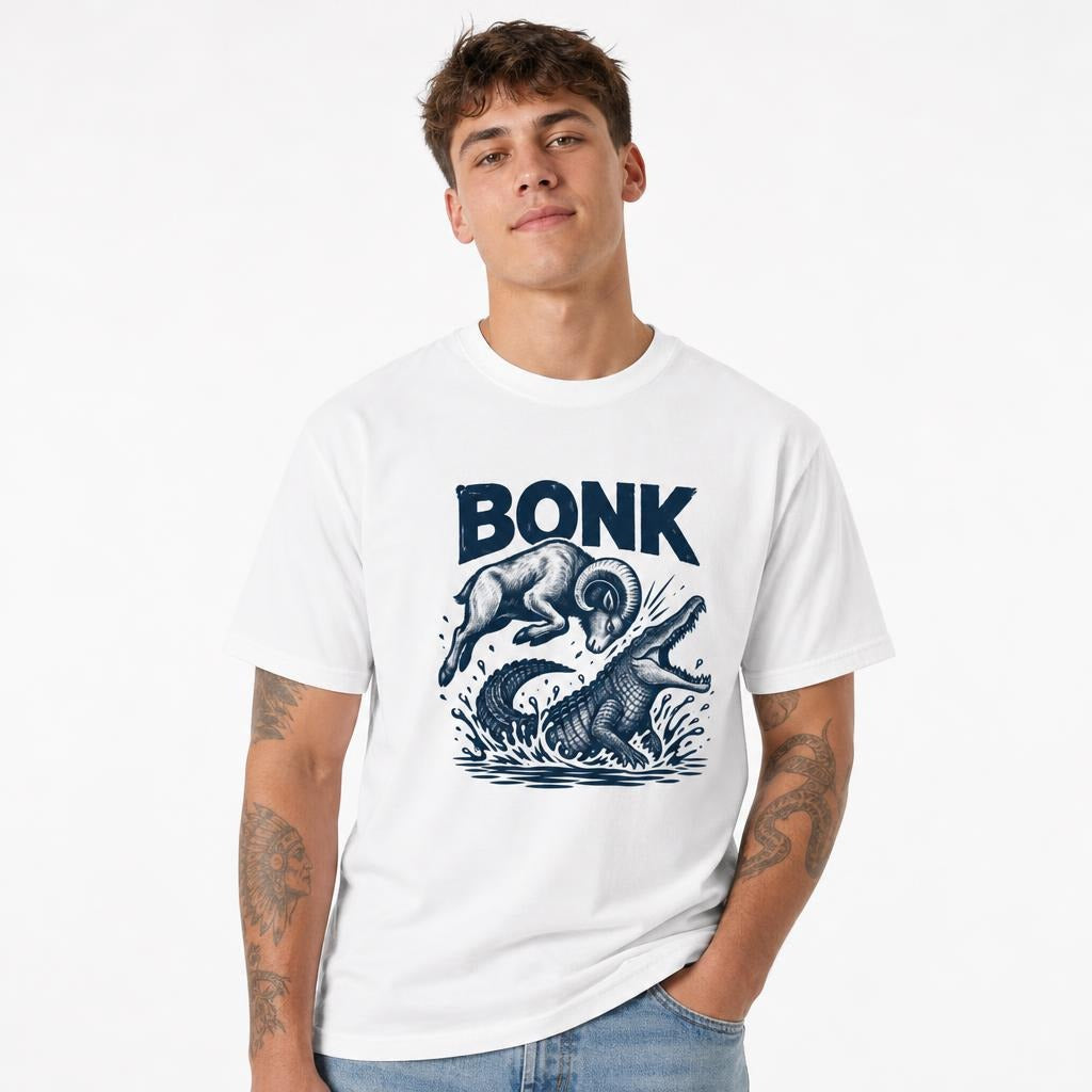 Model wearing a white T-shirt with a navy illustration of a leaping ram colliding with a crocodile in splashing water, labeled BONK.