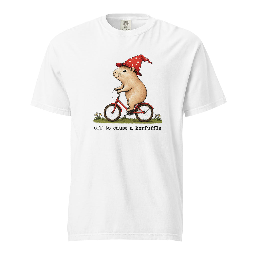 Front view of a white T-shirt with a rat in a red polka-dot hat riding a red bicycle above the words “off to cause a kerfuffle.”