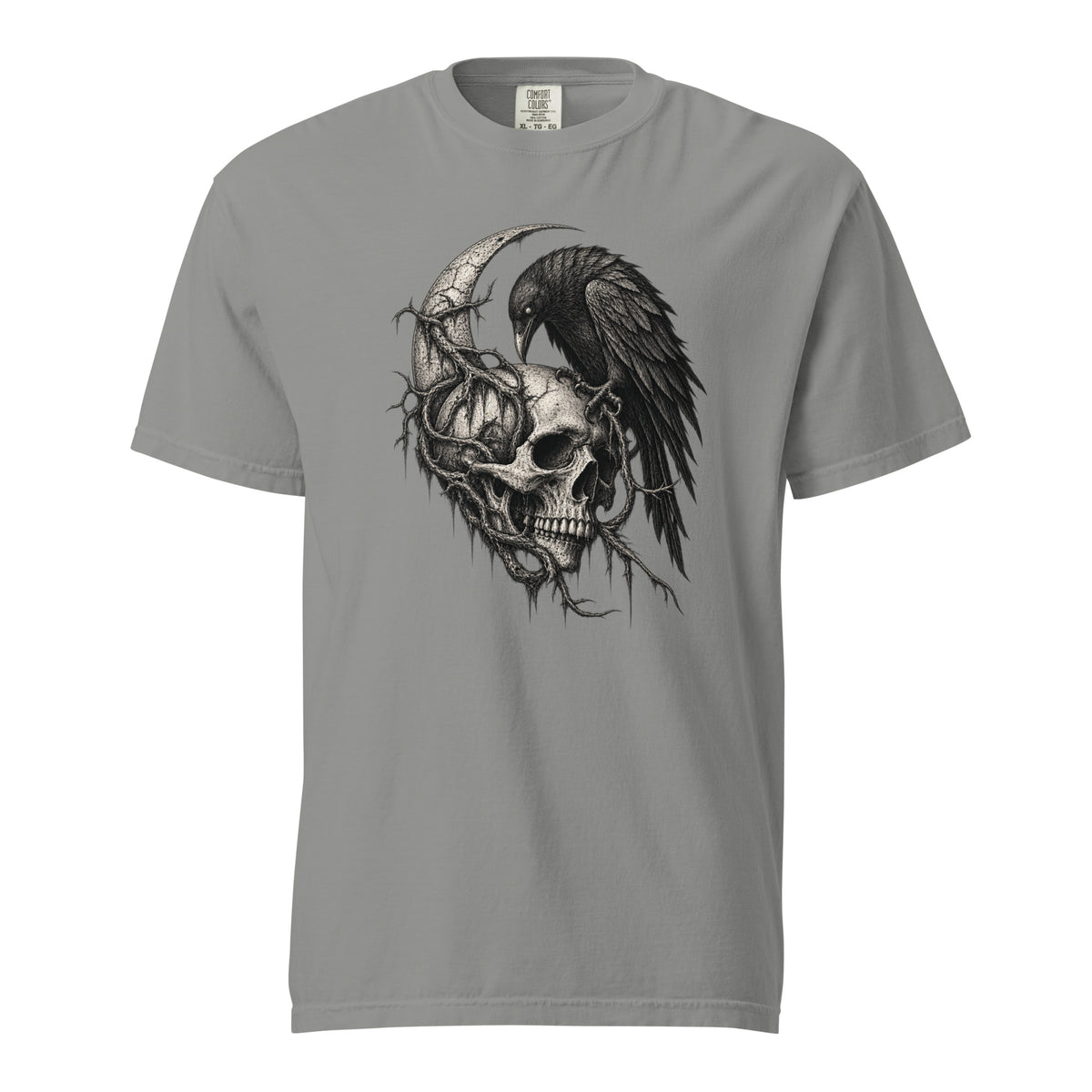 Front view of a grey T-shirt featuring a detailed monochrome skull, raven, and crescent moon graphic with botanical elements.