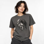 Front view of a Pepper T-shirt featuring a detailed monochrome skull, raven, and crescent moon graphic.