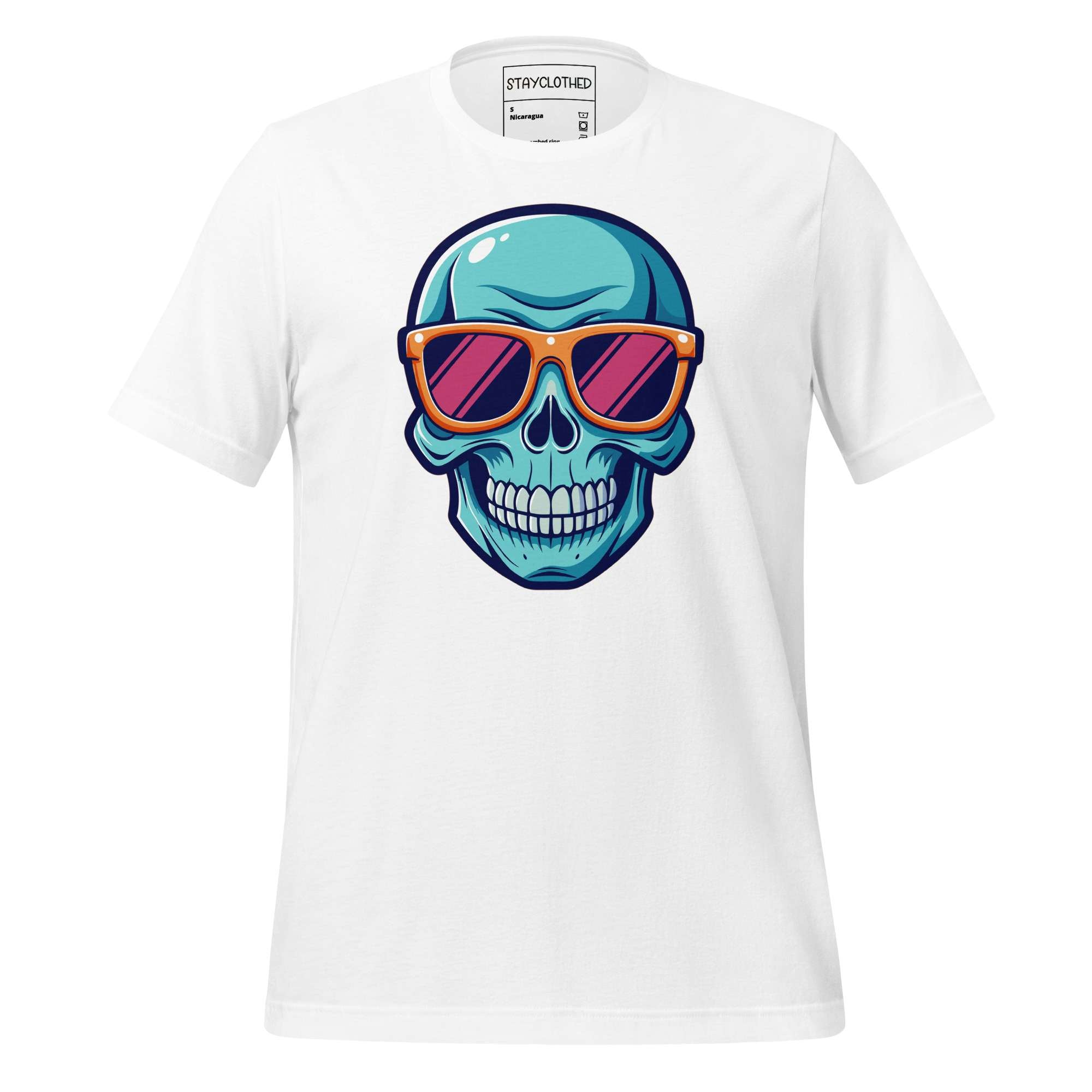 White t-shirt with a colorful skull design wearing sunglasses on a wooden surface, featuring the brand 'StayClothed'.
