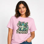 Smokalotl Funny Alien Graphic t shirt in Blossom worn by a studio model in an upper-body front relaxed pose on a clean white background