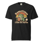 Front view of a black T-shirt with “Sometimes I Just Be Fartin,” featuring a frog holding a steaming coffee cup before a striped sunset.