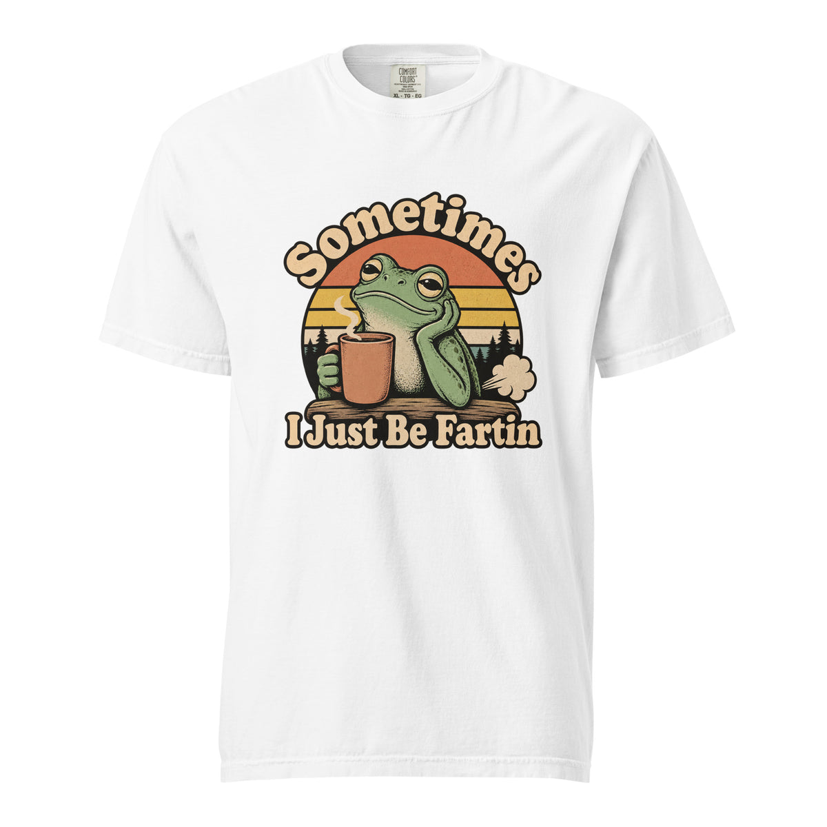 Front view of a white T-shirt with a frog holding a steaming coffee cup, sunset stripes, trees, and “Sometimes I Just Be Fartin” text.