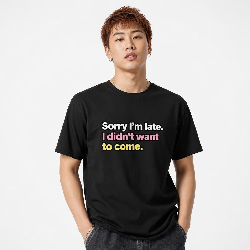 Model wearing a black T-shirt with bold multicoloured text reading “Sorry I’m late. I didn’t want to come.”