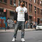 South Asian man wearing a white autism awareness puzzle heart t-shirt.