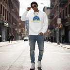 South Asian man wearing a white Be Kind autism awareness sweatshirt.
