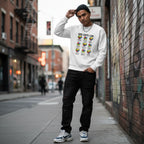 South Asian man wearing a white God Says I Am autism awareness sweatshirt with puzzle hearts.