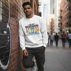 South Asian man wearing a white "I'm Not Misbehaving I Have Autism Please Be Understanding" sweatshirt.