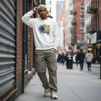 South Asian man wearing a white In April We Wear Blue autism awareness sweatshirt.