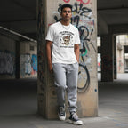 South Asian man wearing a white t-shirt in an urban streetwear setting