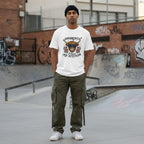 South Asian man in a streetwear style photo wearing a white t-shirt.