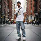 South Asian man wearing a white neurodiversity t-shirt in a streetwear style.
