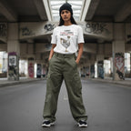 South Asian woman wearing a white streetwear t-shirt outdoors