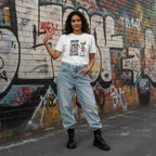 South Asian woman wearing a white streetwear t-shirt outdoors.