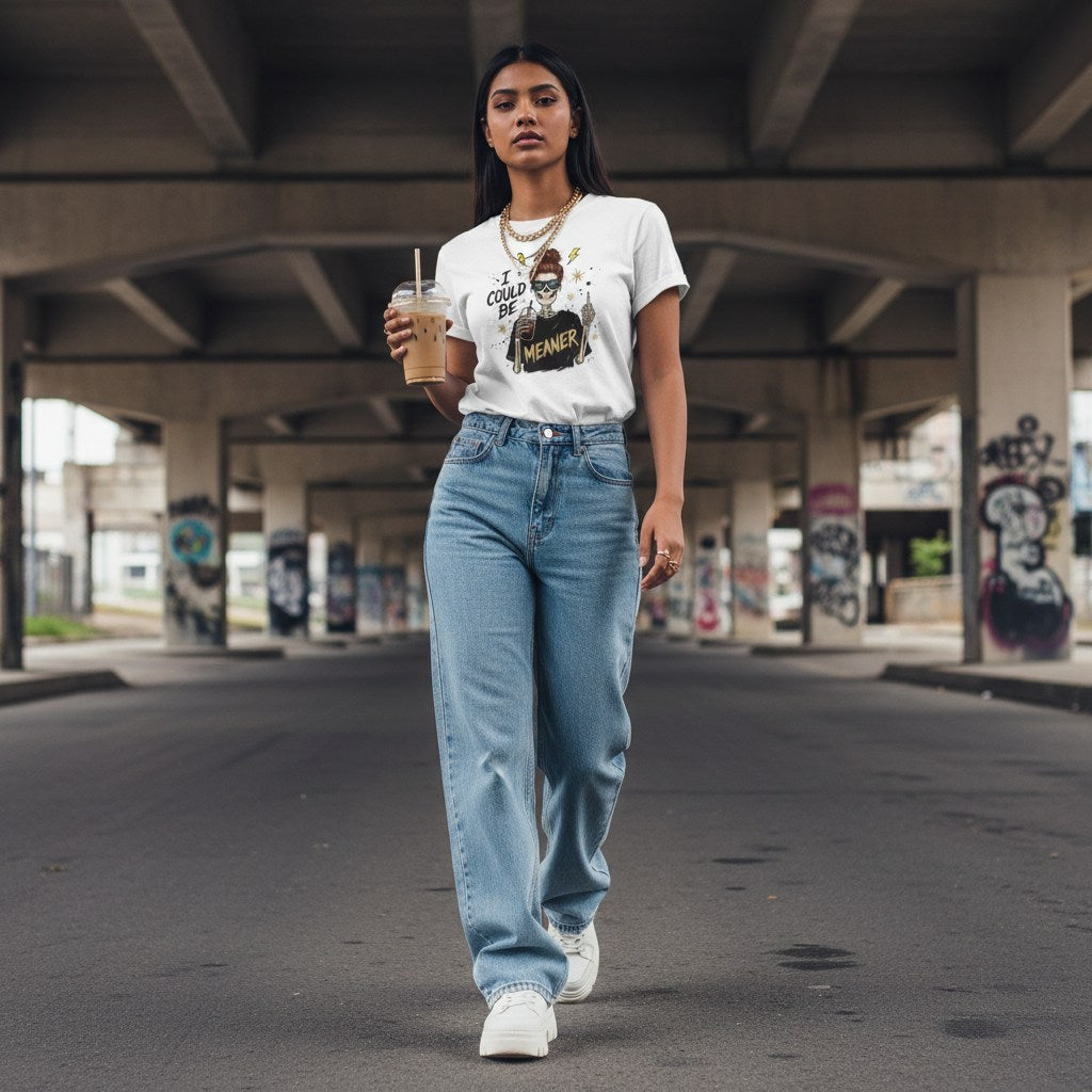 South Asian woman wearing a white streetwear t-shirt outdoors.