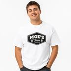 Front view of a person wearing a white T-shirt with a vintage Moe’s Tavern sign, Springfield text, and beer mugs.
