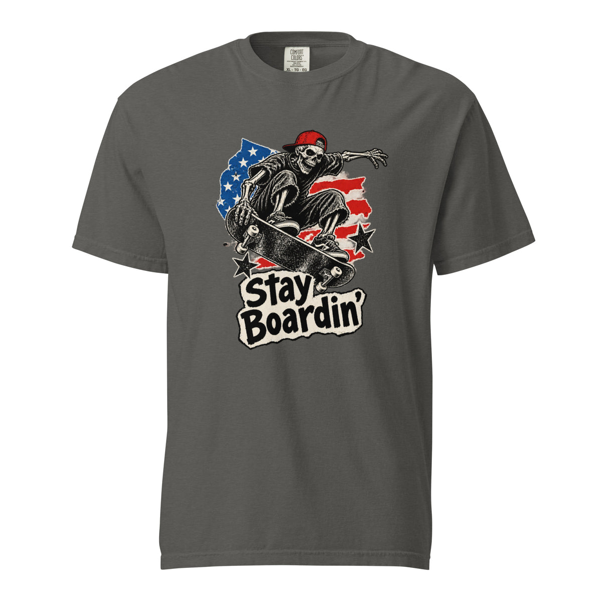 Front view of a Pepper T-shirt with a skeleton riding a skateboard, American flag details, and “Stay Boardin'” text.