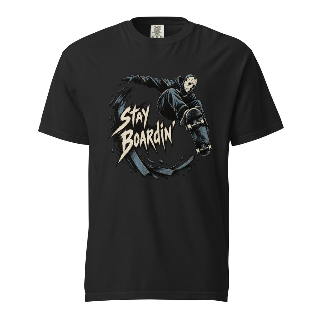 Front view of a black T-shirt featuring a masked airborne skateboarder, skateboard, and jagged cream “STAY BOARDIN” lettering.