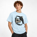 Model wearing a Chambray T-shirt with a masked skateboarder airborne above a skateboard and Stay Boardin lettering.