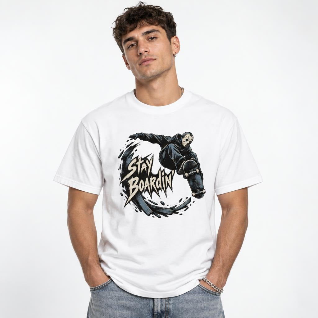 Model wearing a White T-Shirt with a graphic of a hockey mask skateboarder airborne above a skateboard and Stay Boardin lettering.