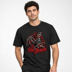 Model wearing a black T-shirt with a horror figure, skateboard, and distressed red “STAY BOARDIN’” front graphic.