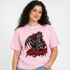 Model wearing a Blossom T-shirt with a front graphic of a horror figure, skateboard, and distressed red “STAY BOARDIN’” text.