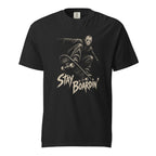Front view of a black T-shirt featuring a masked skater crouching on a skateboard above distressed cream “STAY BOARDIN’” lettering.