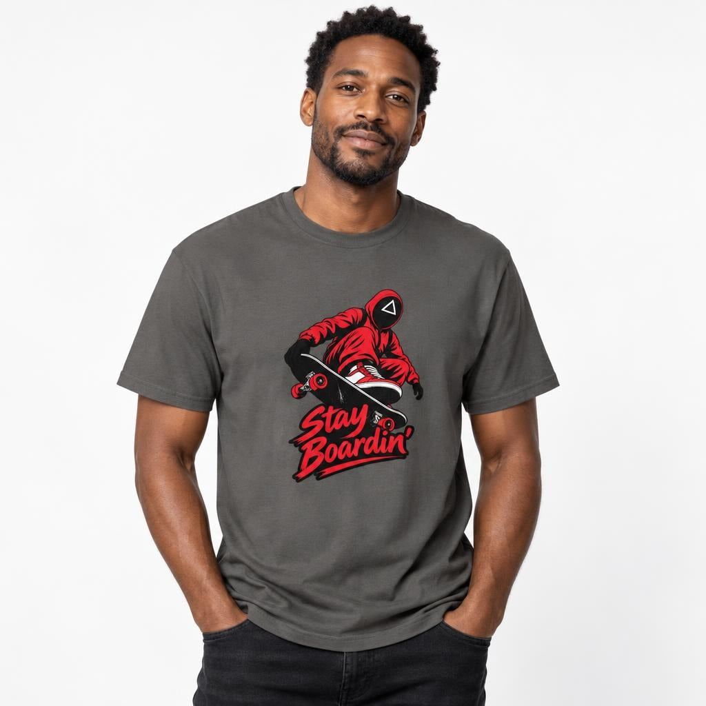 Front view of a Pepper T-shirt featuring a masked skateboarder riding a skateboard above bold red “Stay Boardin’” lettering.