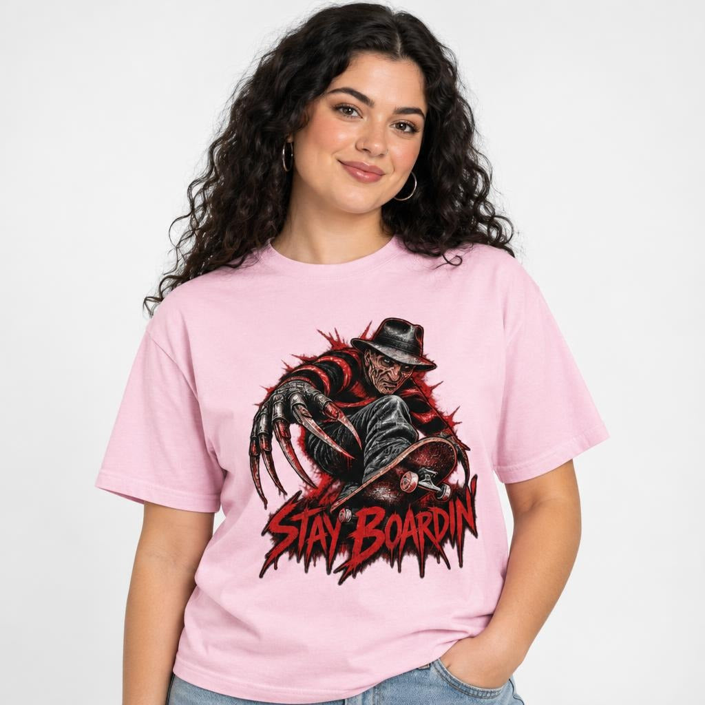 Front view of a Blossom T-shirt featuring a dark horror figure with elongated claws and a skateboard above distressed red “STAY BOARDIN’” lettering.