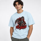 A model wears a Chambray T-shirt with a dark horror figure, skateboard, and distressed red “STAY BOARDIN’” graphic.