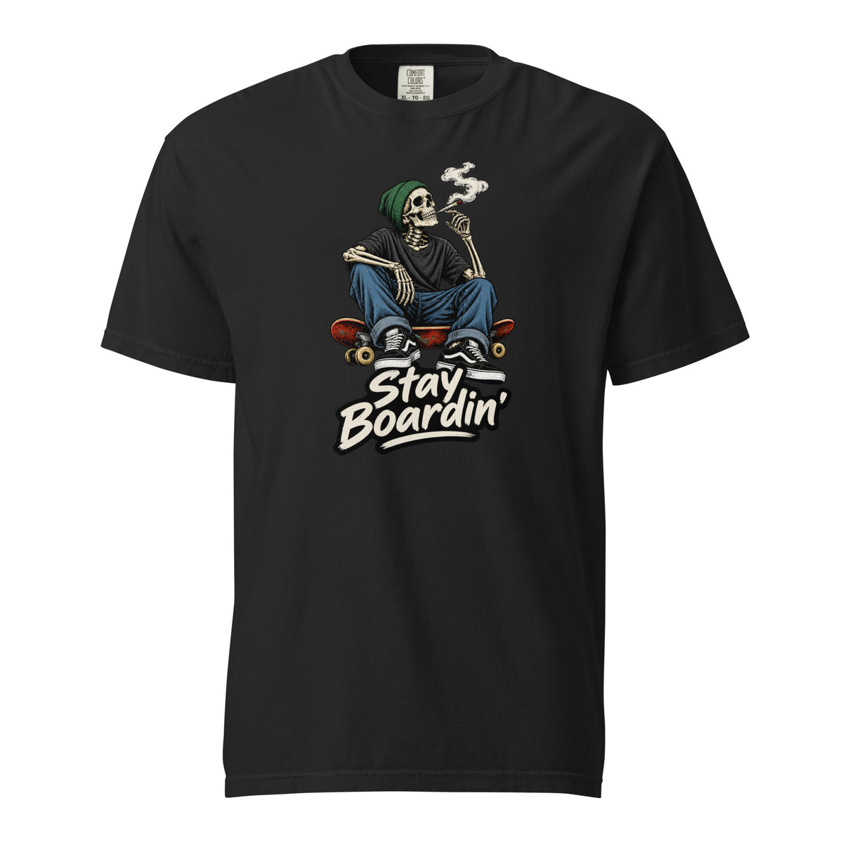 Front view of a black T-shirt with a seated smoking skeleton wearing a green beanie on a skateboard above “Stay Boardin’” lettering.