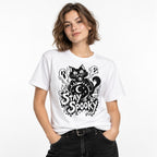 Model wearing a white T-shirt featuring a black cat behind a crystal ball, three ghosts, stars, a crescent moon and “STAY SPOOKY” lettering.