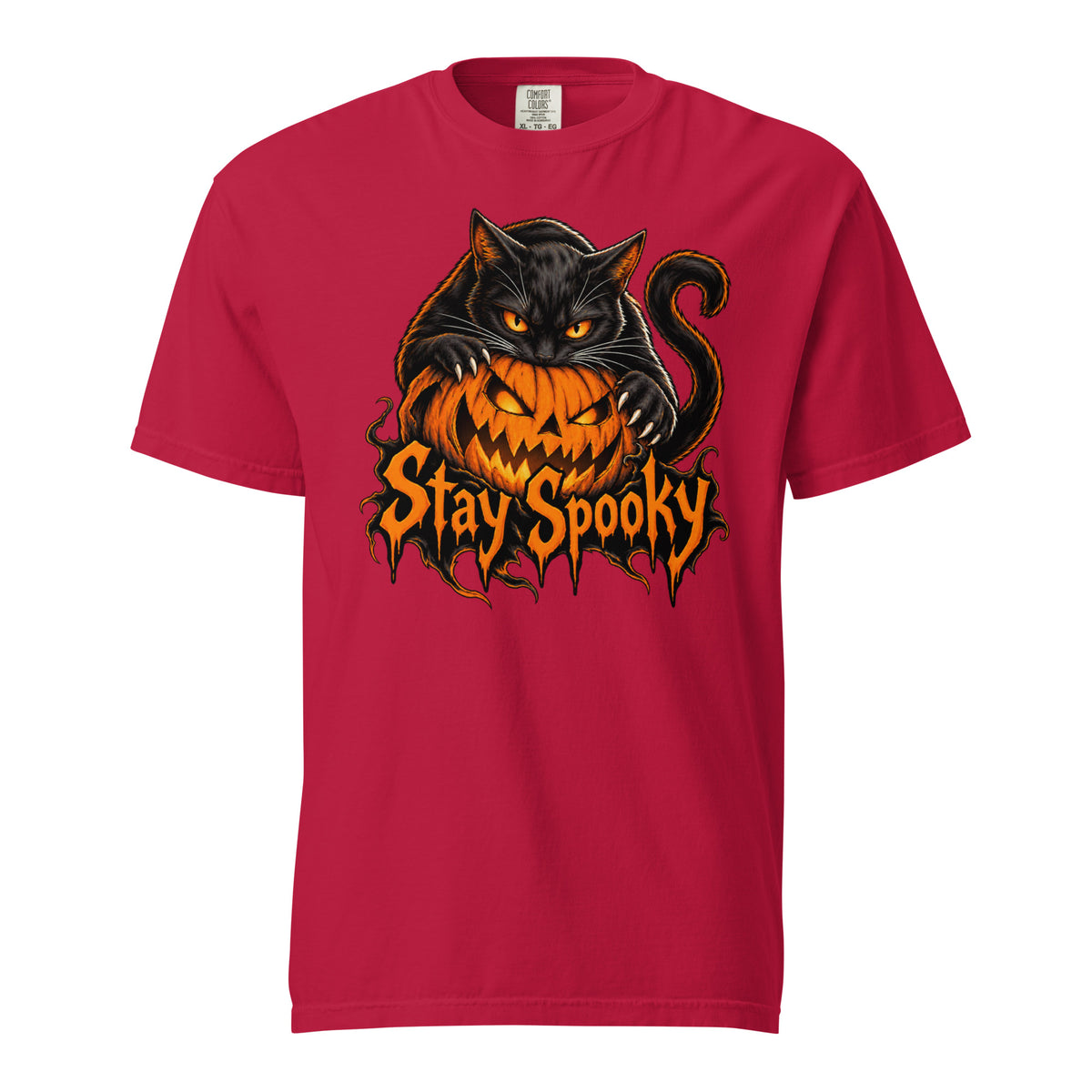 Front view of a red T-shirt featuring a black cat with orange eyes draped over a grinning pumpkin and Stay Spooky lettering.