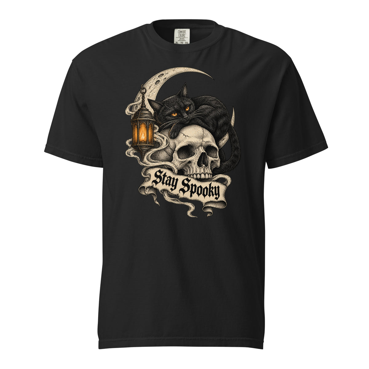 Front view of a black T-shirt featuring a black cat with amber eyes resting on a skull beside a glowing lantern and Stay Spooky banner.