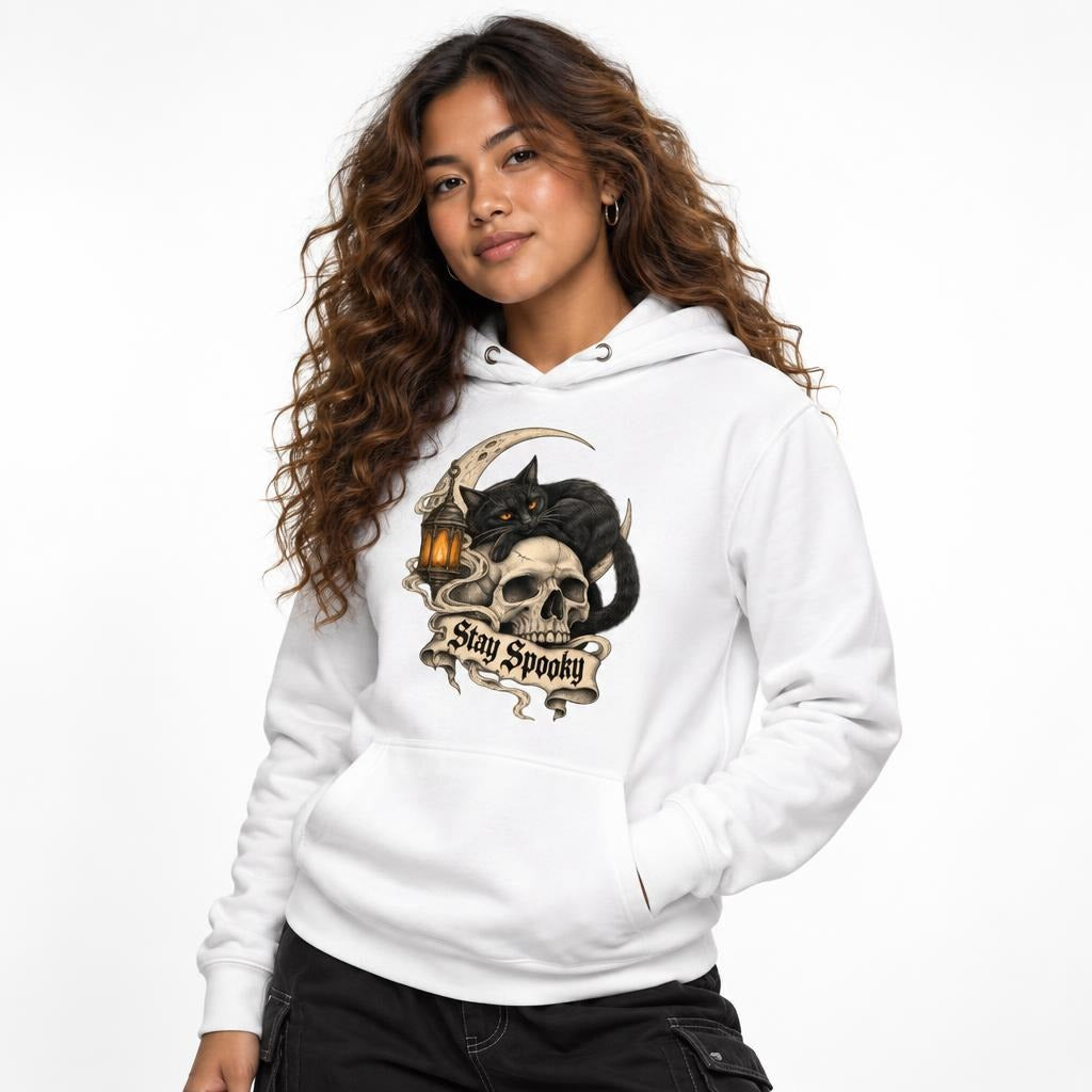 Front view of a model wearing a White hoodie with a black cat, skull, crescent moon, lantern, and “Stay Spooky” artwork.