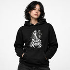 Model wearing a black hoodie with a front graphic of a floating ghost holding a lantern above dripping “Stay Spooky” lettering.