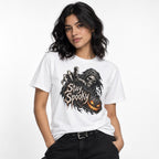 Front view of a white T-shirt featuring Stay Spooky lettering, a hooded Grim Reaper with a skull face, and a glowing pumpkin.