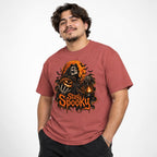Model wearing a Crimson T-shirt with a Grim Reaper, Pumpkin, and Lantern beneath bold orange “Stay Spooky” lettering.