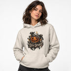 Front view of an Oatmeal Heather hoodie worn by a model, featuring a grinning jack-o'-lantern, ghosts, skeleton, and “STAY SPOOKY” text.