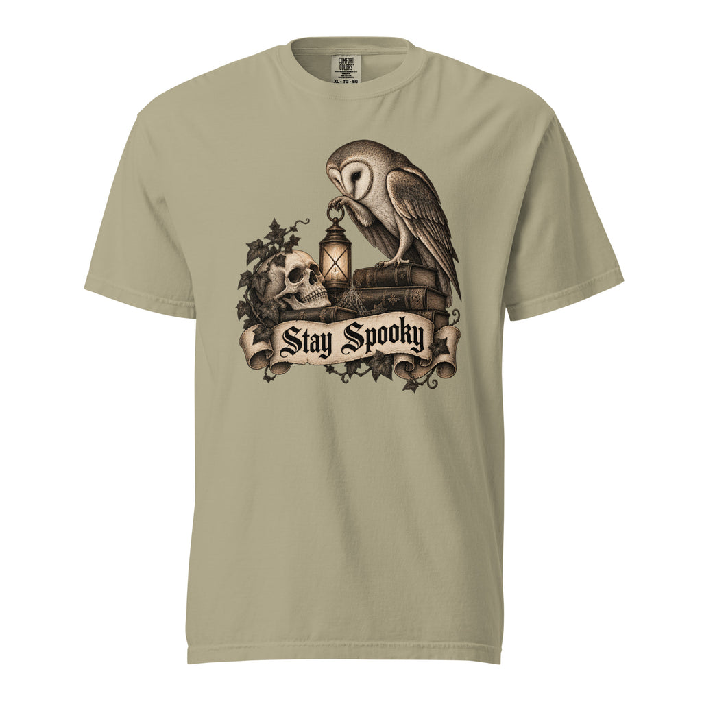Front view of a Khaki T-Shirt featuring an owl, skull and lantern above a “Stay Spooky” scroll banner.