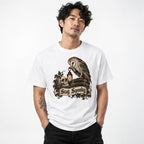 Front view of a person wearing a white T-shirt with an owl, skull, lantern and Stay Spooky artwork.