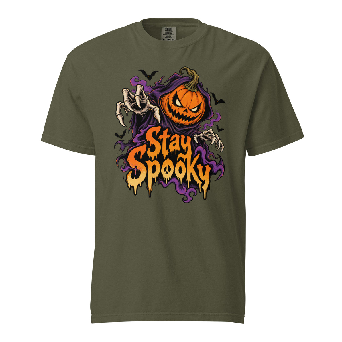 Sage t shirt featuring A front chest graphic reads “Stay Spooky” in large dripping orange and cream lettering. Above it is an angry orange jack-o’-lantern framed by purple smoky shapes, with reaching skeletal hands and s