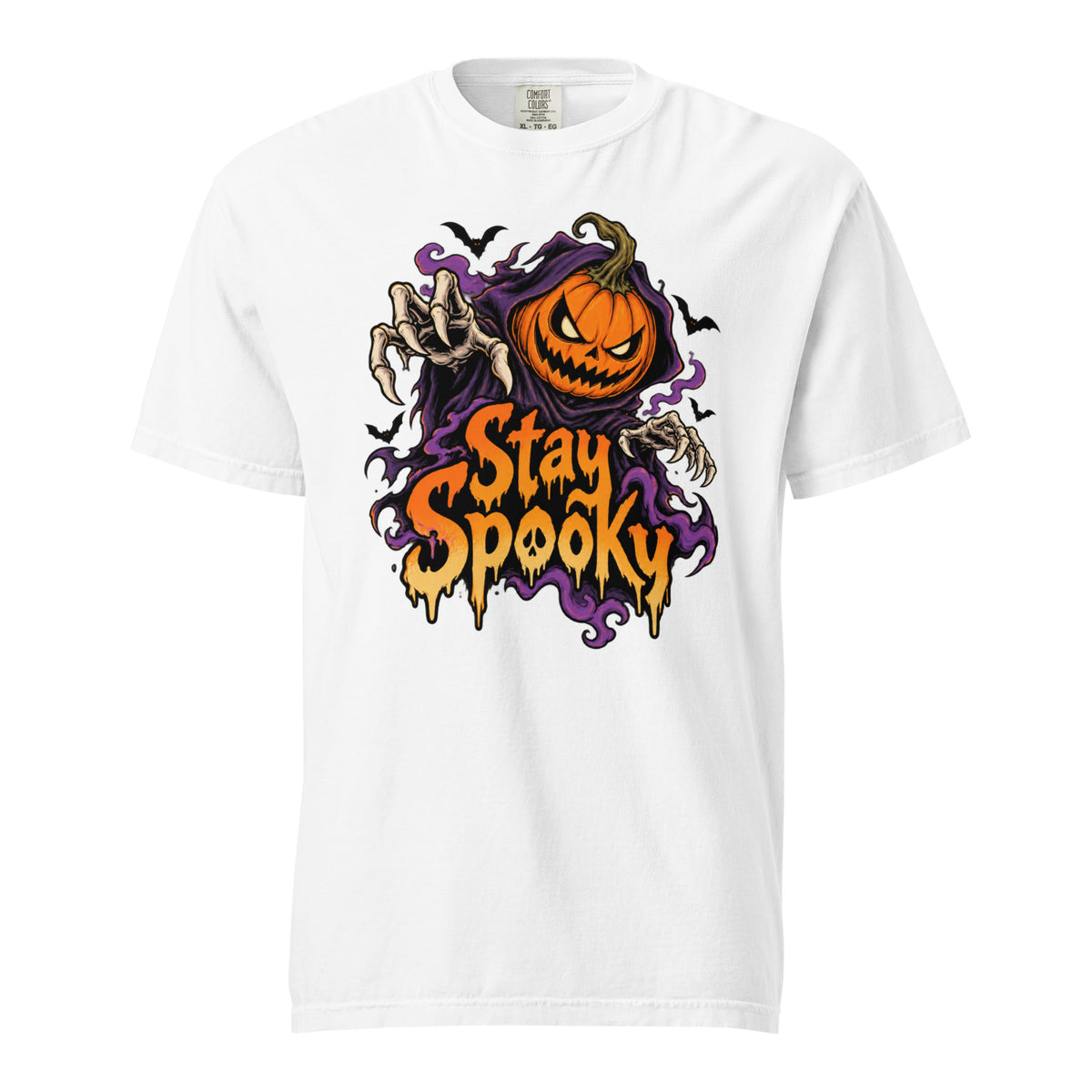White t shirt featuring A front chest graphic reads “Stay Spooky” in large dripping orange and cream lettering. Above it is an angry orange jack-o’-lantern framed by purple smoky shapes, with reaching skeletal hands and