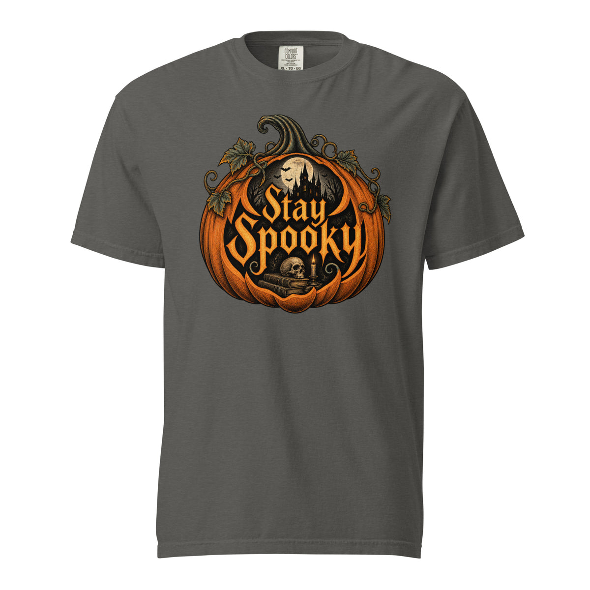 Front view of a Pepper T-shirt featuring a pumpkin, skull, haunted castle, moon, bats, and ornate “Stay Spooky” lettering.