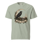Front view of a Bay T-shirt featuring a black raven, skull, crescent moon, candle and ivy beneath a “Stay Spooky” scroll.